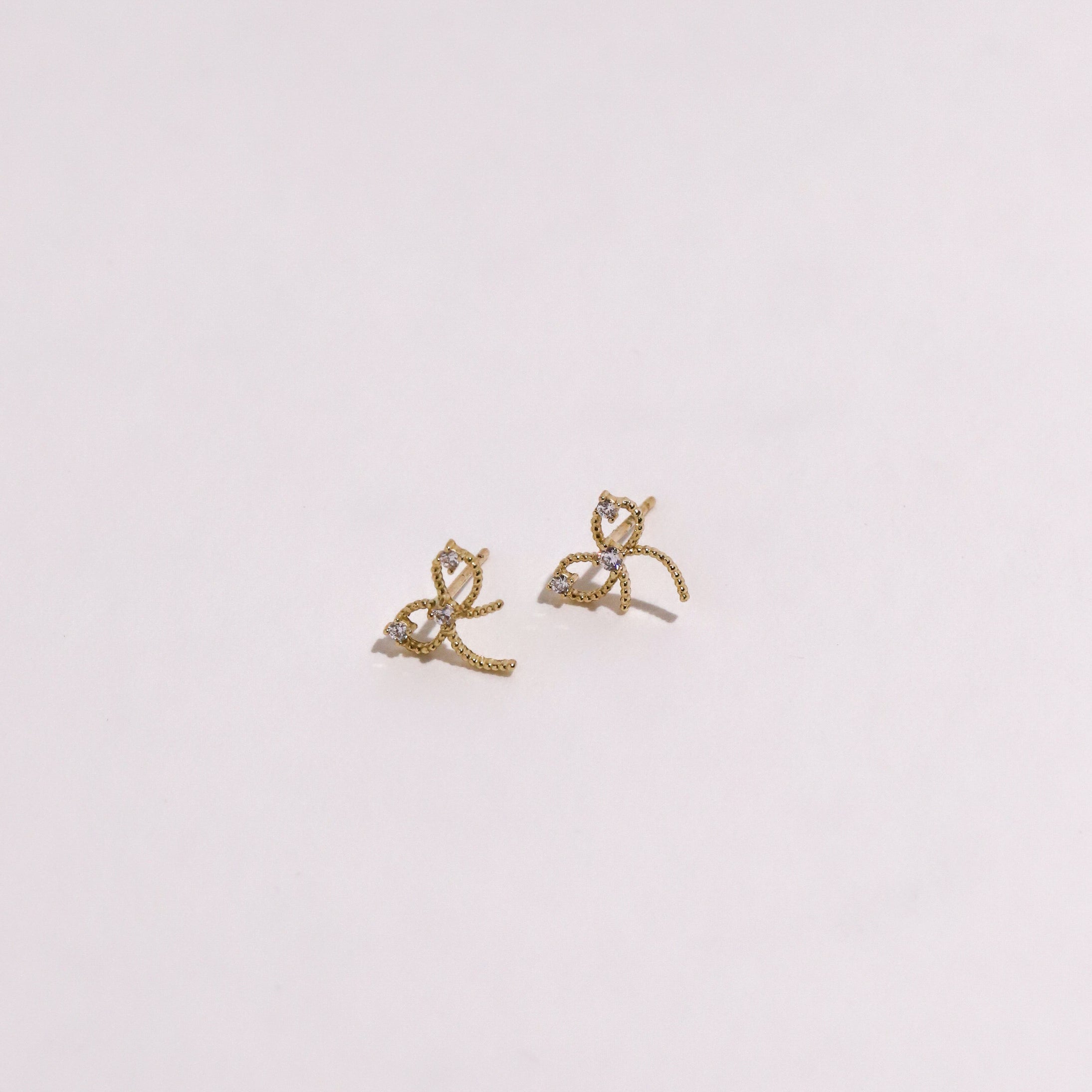10K Gold Twisted Bow with Cubic Studs – Alrok