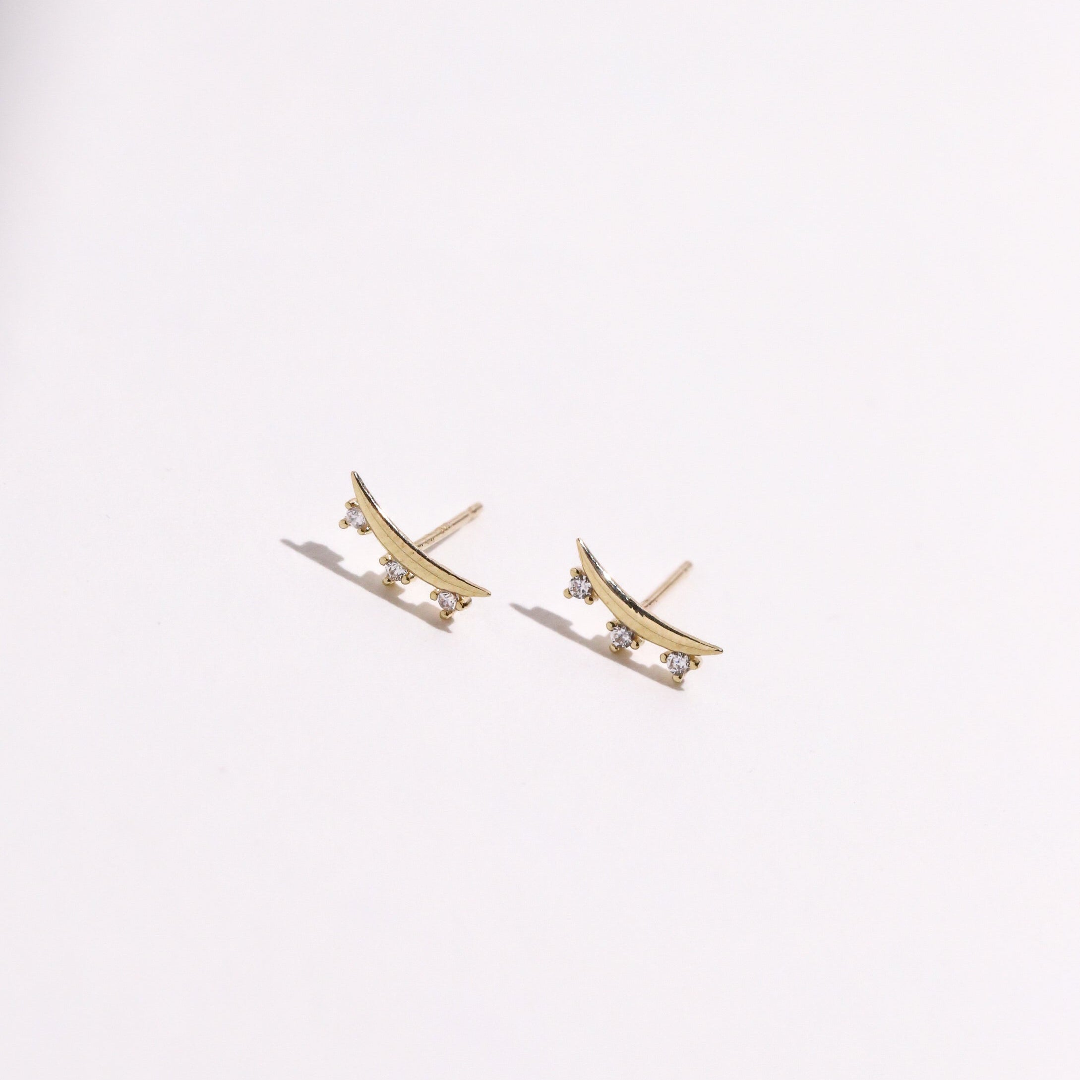 10K Gold Curve Shape with 3 Cubic Studs