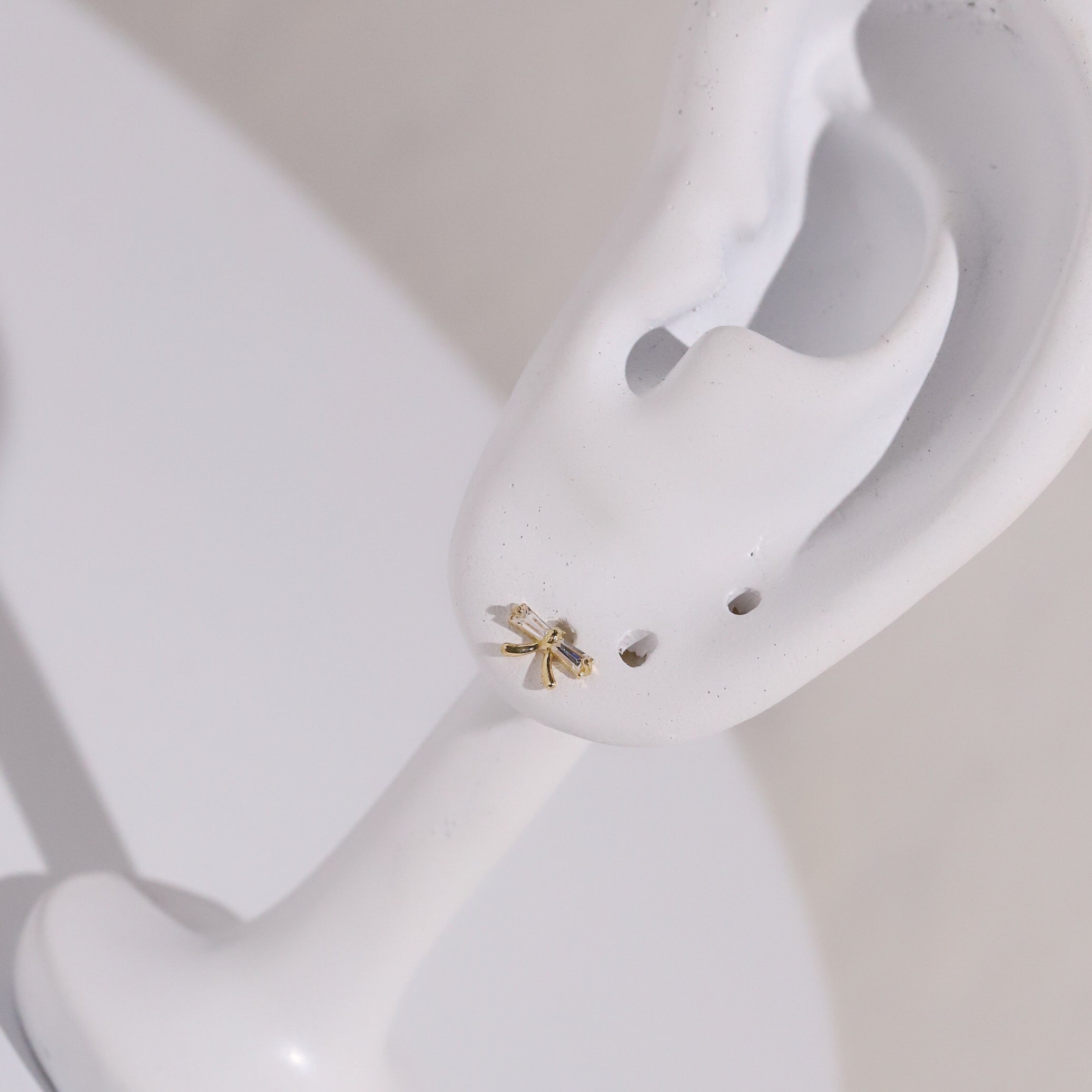 10K Gold Bow with Baguette Cubic Studs