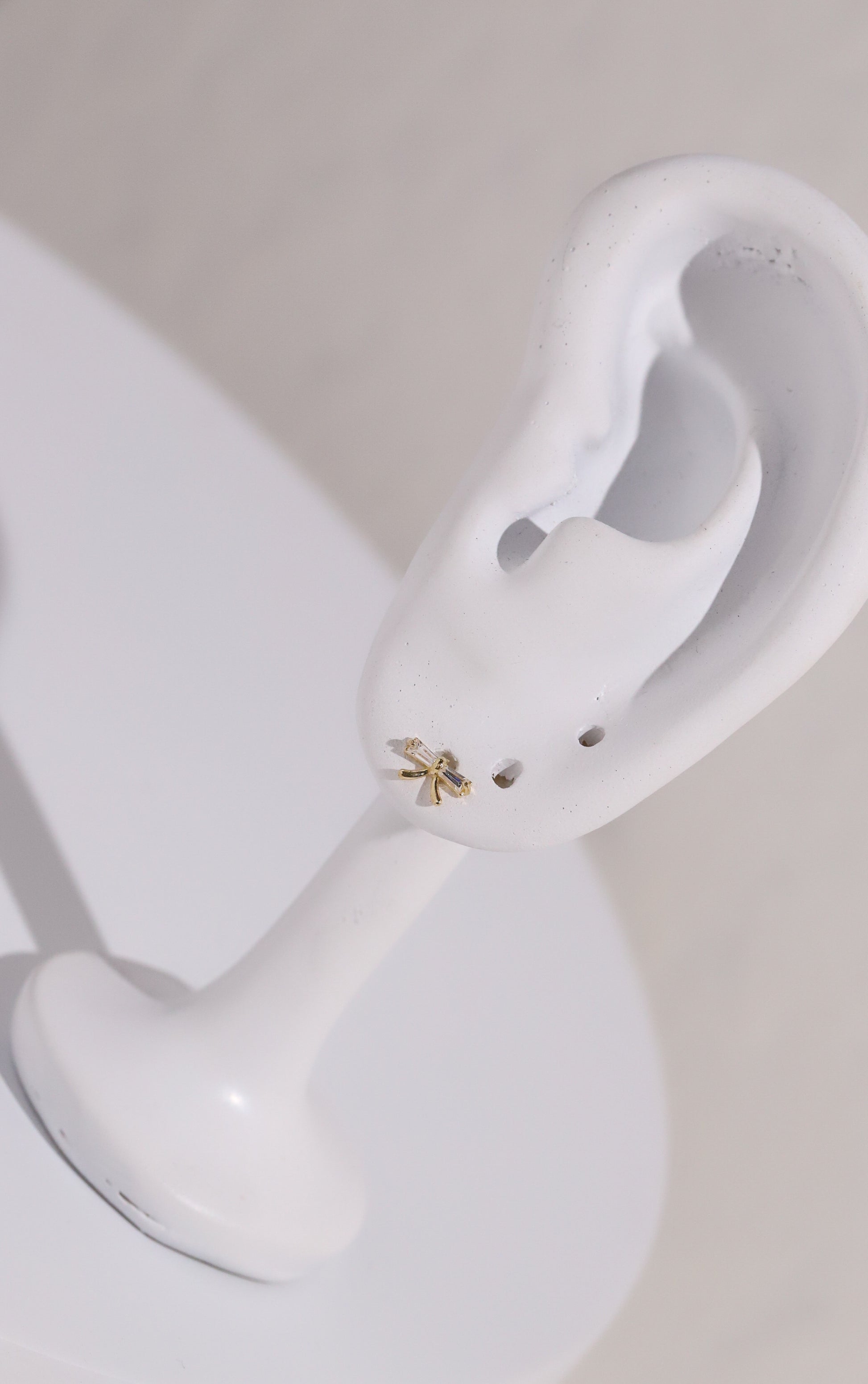 10K Gold Bow with Baguette Cubic Studs